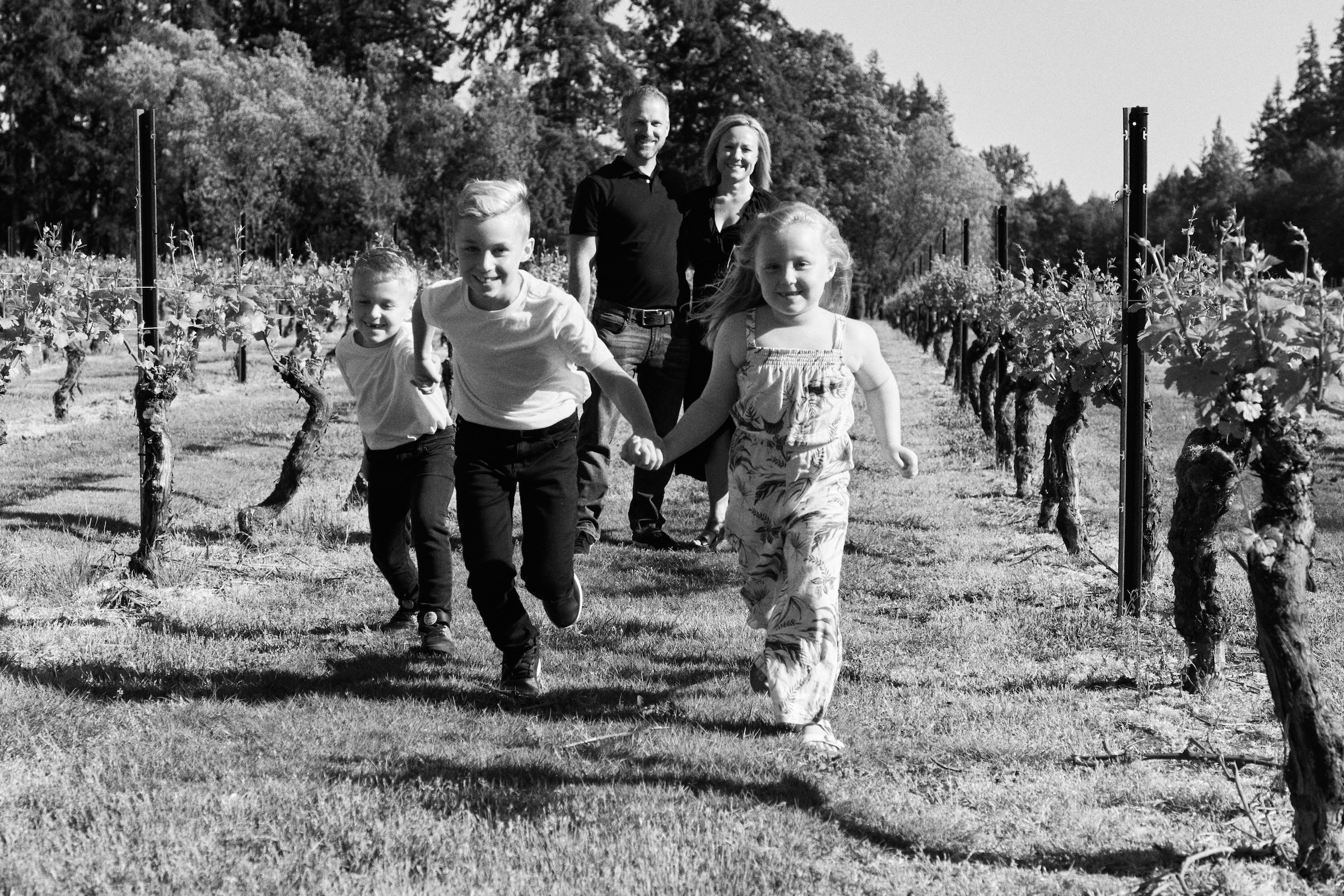 Black and white candid family portrait capturing tender intergenerational connection