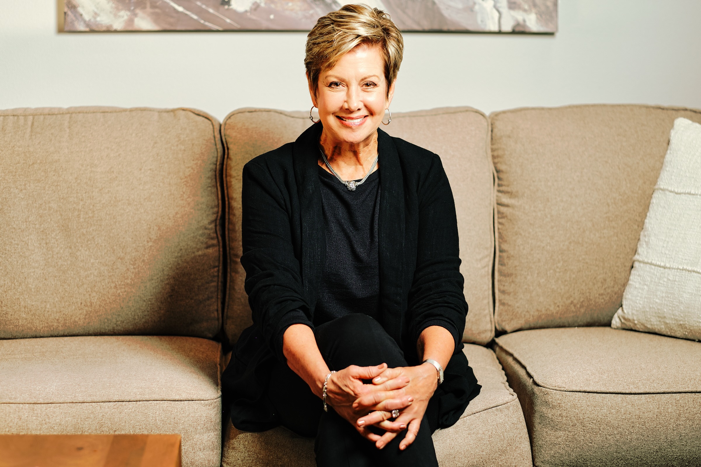 Warm, confident portrait of a professional realtor in natural daylight in Ridgefield Washington